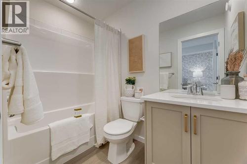 PLEASE NOTE: Photos are of a finished Showhome of the same model – fit and finish may differ on finished spec home. Interior selections and floorplans shown in photos - 62 Starling Boulevard Nw, Calgary, AB - Indoor Photo Showing Bathroom