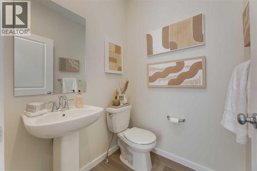 PLEASE NOTE: Photos are of a finished Showhome of the same model – fit and finish may differ on finished spec home. Interior selections and floorplans shown in photos - 62 Starling Boulevard Nw, Calgary, AB - Indoor Photo Showing Bathroom