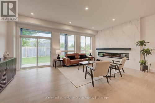 62 Lovett Lane, Guelph (Kortright West), ON - Indoor Photo Showing Living Room With Fireplace