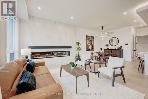 62 Lovett Lane, Guelph (Kortright West), ON - Indoor Photo Showing Living Room With Fireplace