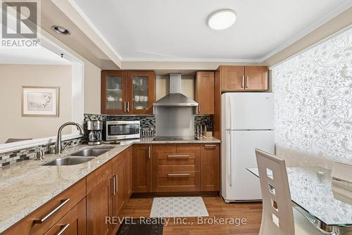 69 - 6767 Thorold Stone Road, Niagara Falls (Stamford), ON - Indoor Photo Showing Kitchen With Double Sink