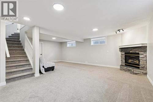 230 Chaparral Place Se, Calgary, AB - Indoor Photo Showing Basement With Fireplace