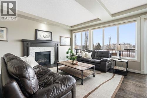 52 Elgin Estates View Se, Calgary, AB - Indoor Photo Showing Living Room With Fireplace