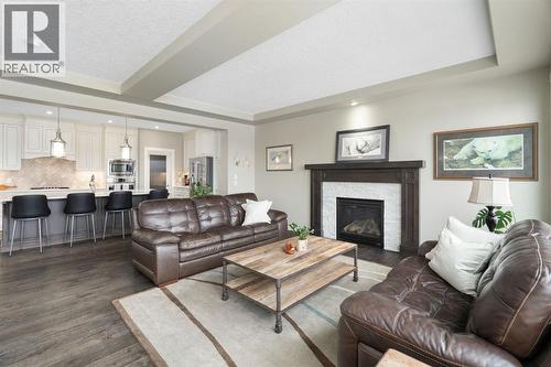 52 Elgin Estates View Se, Calgary, AB - Indoor Photo Showing Living Room With Fireplace