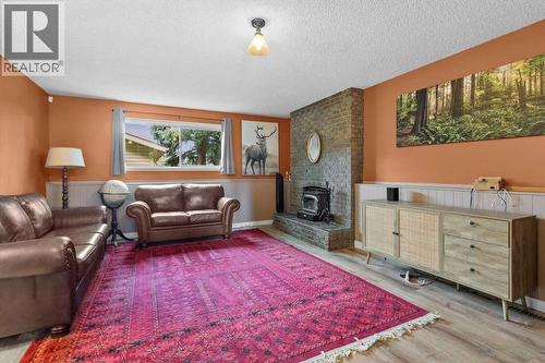40 Bergen Place Nw, Calgary, AB - Indoor Photo Showing Living Room With Fireplace