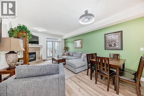 111, 1005B Westmount Drive, Strathmore, AB - Indoor Photo Showing Living Room With Fireplace