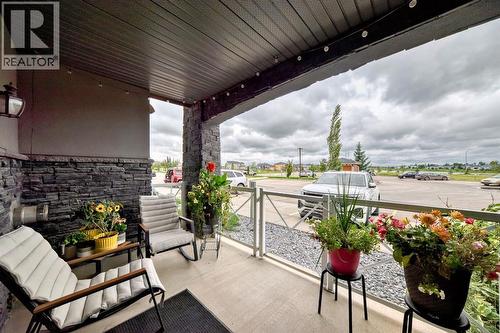 111, 1005B Westmount Drive, Strathmore, AB - Outdoor With Deck Patio Veranda With Exterior