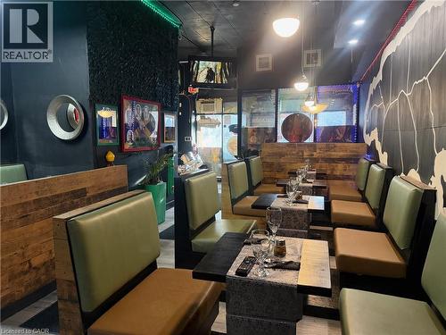 Dining room featuring wood finished floors - 597 King Street, Hamilton, ON 