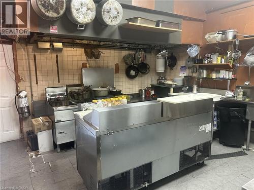 Kitchen with range hood - 597 King Street, Hamilton, ON 