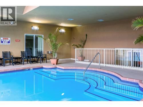 1088 Sunset Drive Unit# 435, Kelowna, BC - Indoor Photo Showing Other Room With In Ground Pool