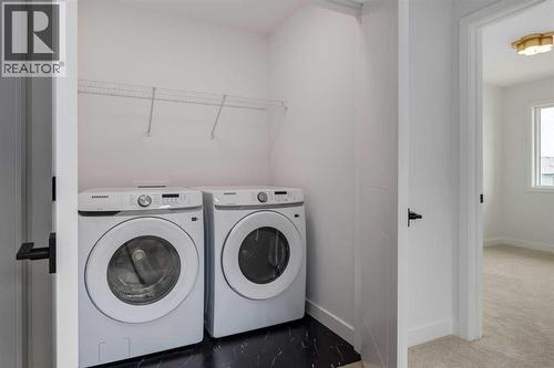 281 Cobblestone Gate, Airdrie, AB - Indoor Photo Showing Laundry Room