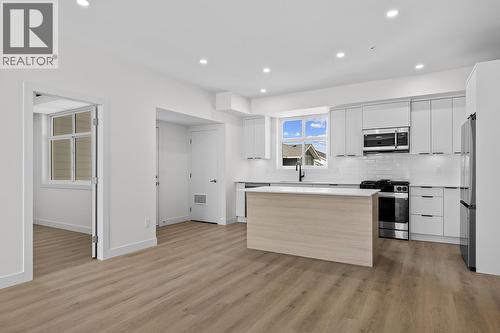 Photos may be of a similar home in the community - 5300 Main Street Unit# 204, Kelowna, BC - Indoor Photo Showing Kitchen With Upgraded Kitchen