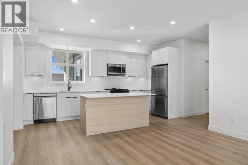 Photos may be of a similar home in the community - 5300 Main Street Unit# 204, Kelowna, BC - Indoor Photo Showing Kitchen With Stainless Steel Kitchen With Upgraded Kitchen