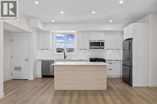 Photos may be of a similar home in the community - 5300 Main Street Unit# 204, Kelowna, BC - Indoor Photo Showing Kitchen With Stainless Steel Kitchen With Upgraded Kitchen