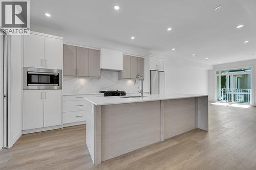 Photos may be of a similar home in the community - 5300 Main Street Unit# 118, Kelowna, BC - Indoor Photo Showing Kitchen With Upgraded Kitchen