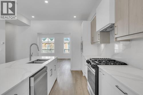 Photos may be of a similar home in the community - 5300 Main Street Unit# 118, Kelowna, BC - Indoor Photo Showing Kitchen With Double Sink With Upgraded Kitchen