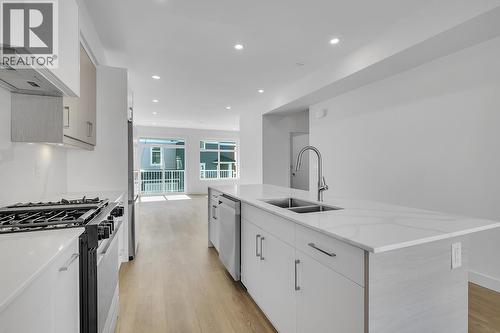 Photos may be of a similar home in the community - 5300 Main Street Unit# 118, Kelowna, BC - Indoor Photo Showing Kitchen With Double Sink With Upgraded Kitchen