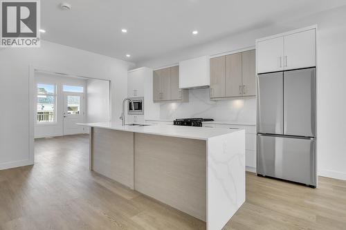 Photos may be of a similar home in the community - 5300 Main Street Unit# 118, Kelowna, BC - Indoor Photo Showing Kitchen With Upgraded Kitchen