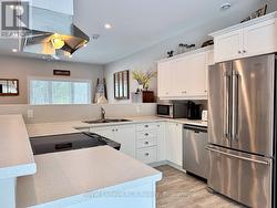 Crisp, white, modern kitchen. - 