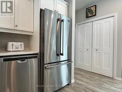 Built-in appliances and double door pantry. - 