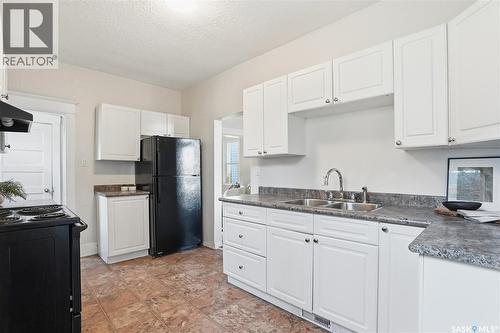 320 D Avenue S, Saskatoon, SK - Indoor Photo Showing Kitchen With Double Sink