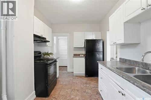 320 D Avenue S, Saskatoon, SK - Indoor Photo Showing Kitchen With Double Sink