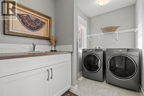 85 Mount Rae Heights, Okotoks, AB - Indoor Photo Showing Laundry Room
