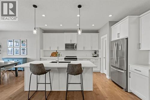 85 Mount Rae Heights, Okotoks, AB - Indoor Photo Showing Kitchen With Stainless Steel Kitchen With Upgraded Kitchen