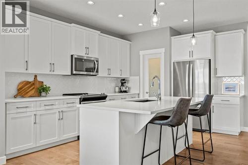 85 Mount Rae Heights, Okotoks, AB - Indoor Photo Showing Kitchen With Stainless Steel Kitchen With Upgraded Kitchen