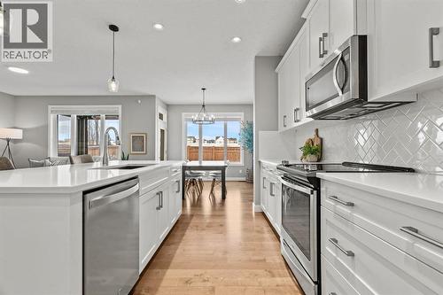 85 Mount Rae Heights, Okotoks, AB - Indoor Photo Showing Kitchen With Stainless Steel Kitchen With Upgraded Kitchen