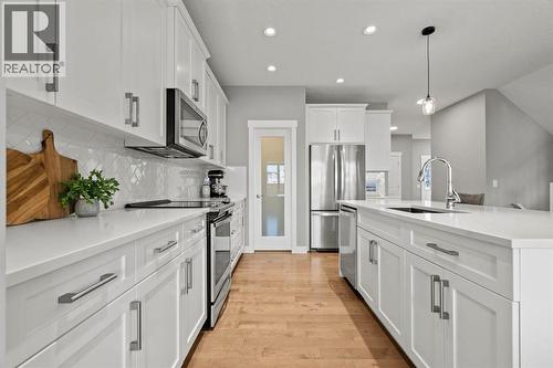 85 Mount Rae Heights, Okotoks, AB - Indoor Photo Showing Kitchen With Stainless Steel Kitchen With Upgraded Kitchen