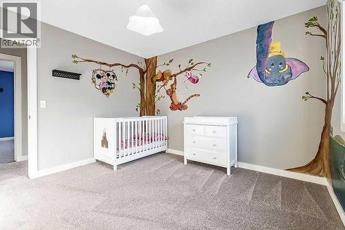94 Cimarron Springs Circle, Okotoks, AB - Indoor Photo Showing Bedroom