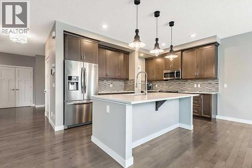 94 Cimarron Springs Circle, Okotoks, AB - Indoor Photo Showing Kitchen With Upgraded Kitchen