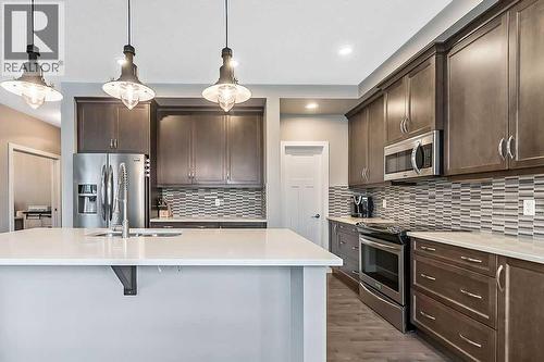 94 Cimarron Springs Circle, Okotoks, AB - Indoor Photo Showing Kitchen With Upgraded Kitchen