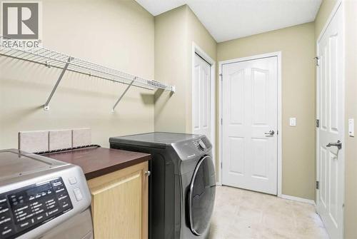 202 Panamount Court Nw, Calgary, AB - Indoor Photo Showing Laundry Room