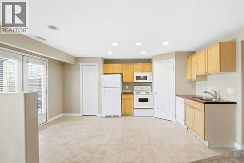 202 Panamount Court Nw, Calgary, AB - Indoor Photo Showing Kitchen With Double Sink