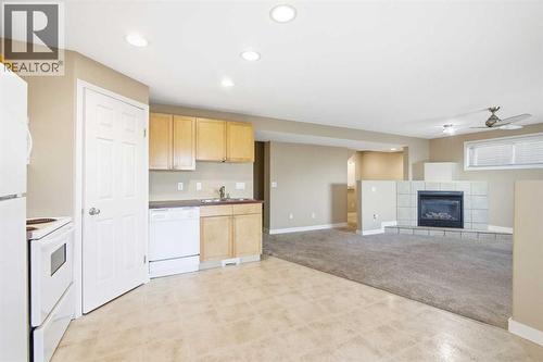 202 Panamount Court Nw, Calgary, AB - Indoor Photo Showing Kitchen With Double Sink