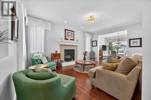 28 Evansview Manor Nw, Calgary, AB - Indoor Photo Showing Living Room With Fireplace