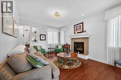 28 Evansview Manor Nw, Calgary, AB - Indoor Photo Showing Living Room With Fireplace