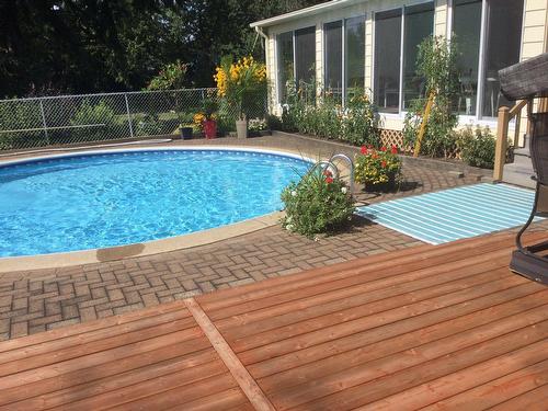 Back facade - 180 Rue Labonté, Rosemère, QC - Outdoor With In Ground Pool With Deck Patio Veranda