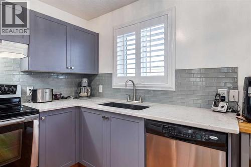 5248 Martin Crossing Drive Ne, Calgary, AB - Indoor Photo Showing Kitchen With Stainless Steel Kitchen With Double Sink