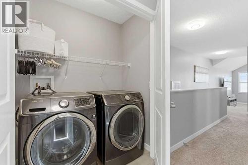 Upper level laundry - 105 Chaparral Valley Crescent Se, Calgary, AB - Indoor Photo Showing Laundry Room