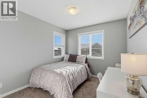 Bedroom #3 with corner windows - 105 Chaparral Valley Crescent Se, Calgary, AB - Indoor Photo Showing Bedroom