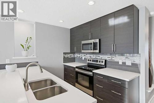Double sink - 105 Chaparral Valley Crescent Se, Calgary, AB - Indoor Photo Showing Kitchen With Double Sink With Upgraded Kitchen