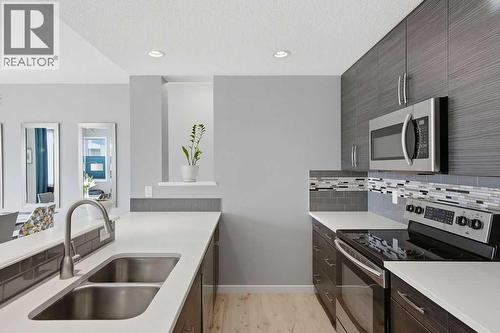 Quartz counters - 105 Chaparral Valley Crescent Se, Calgary, AB - Indoor Photo Showing Kitchen With Double Sink