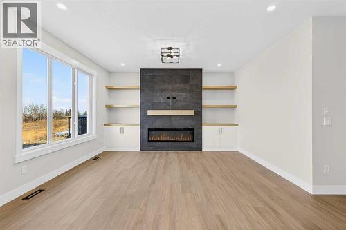 180 Wildrose Drive, Strathmore, AB - Indoor Photo Showing Living Room With Fireplace