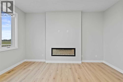 151 Belvedere Crescent Se, Calgary, AB - Indoor With Fireplace