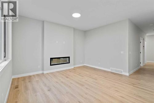 151 Belvedere Crescent Se, Calgary, AB - Indoor With Fireplace