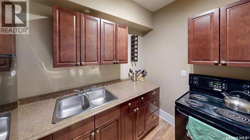 212 2305 Victoria Avenue, Regina, SK - Indoor Photo Showing Kitchen With Double Sink