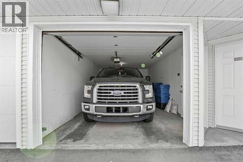 208, 6118 53 Avenue, Red Deer, AB - Indoor Photo Showing Garage